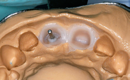 close up of booth model with small metal piece